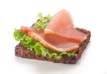 Sandwich with pork balyk, rye bread and lettuce