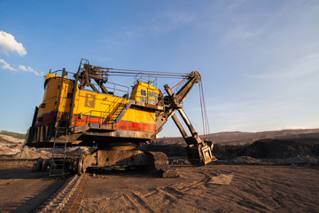 Part of a pit with big mining truck working