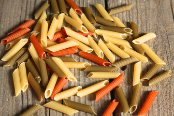 Colored pasta scattered on the table, vintage