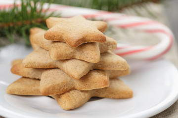 star cookies and candy cane on table