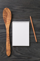 simple blank notepad on rustic wood table, background