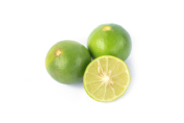 Naklejka na ściany i meble Green lemons on white background
