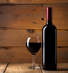 Red wine on wooden background
