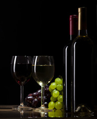 Red and white wine on dark background