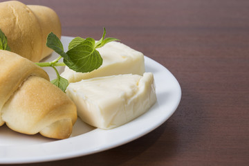 Breakfast with cheese and bread rolls 