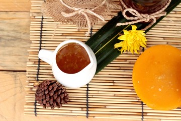 Honey variety with honeycomb and honey in a jar with beeswax.