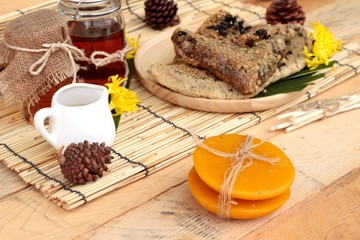 Honey variety with honeycomb and honey in a jar with beeswax.