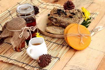 Honey variety with honeycomb and honey in a jar with beeswax.