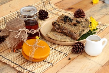 Honey variety with honeycomb and honey in a jar with beeswax.
