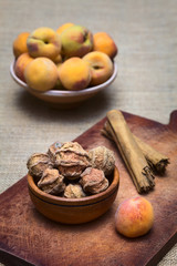 Dried peeled peach called quisa (also kisa, mocochinchi) from which a beverage is prepared with sugar and cinnamon in Bolivia (Selective Focus, Focus on the front peaches).