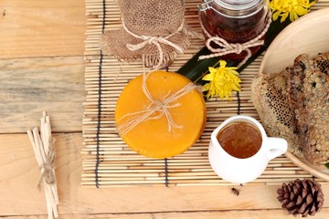 Honey variety with honeycomb and honey in a jar with beeswax.