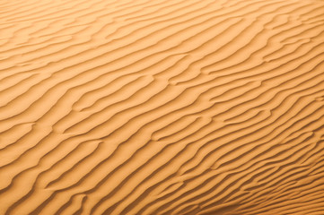 Sand dunes texture in desert