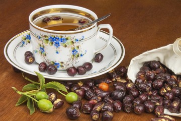 Hot tea with lemon and red arrow in the table. Home treatment for colds and flu. Treating colds using traditional recipes.
