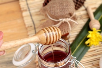 Honey variety with honeycomb and honey in a jar with beeswax.