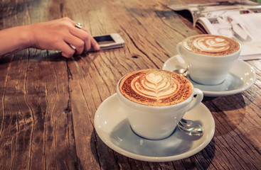 cup of coffee on table in cafe.