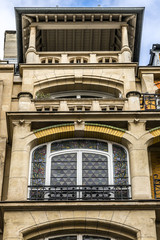 French house with traditional balconies and windows. Paris.