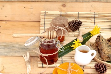 Honey variety with honeycomb and honey in a jar with beeswax.