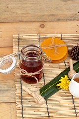 Honey variety with honeycomb and honey in a jar with beeswax.