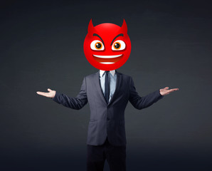 businessman wears devil smiley face