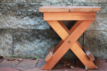 Wooden stool with X legs