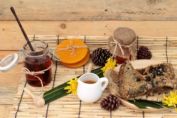 Honey variety with honeycomb and honey in a jar with beeswax.