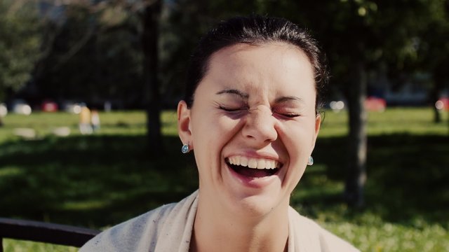 Cute European woman smiles and uses foul language.