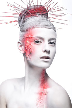 Art fashion girl with white skin and red paint on the face