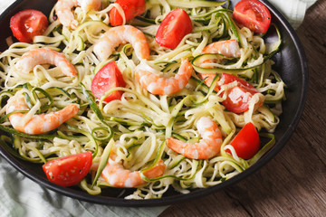 Dietary food: zucchini pasta with shrimp closeup. horizontal 
