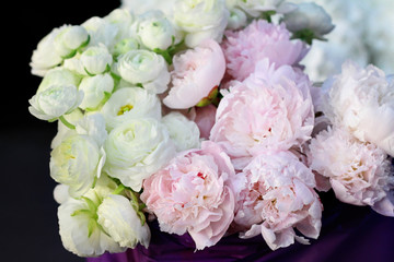 White ranunculus and  peony bouquet. Selective focus image , gently colors