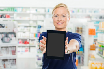 Female Pharmacist Showing Digital Tablet With Blank Screen