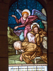 Obraz na płótnie Canvas St. angel talking to. Joseph, stained glass window of the Church
