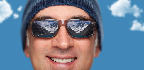 Close up of a man's face wearing sunglasses