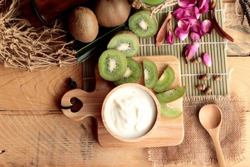 Yogurt white with green kiwi fruit and kiwi juice.