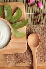 Yogurt white with green kiwi fruit and kiwi juice.
