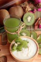 Yogurt white with green kiwi fruit and kiwi juice.