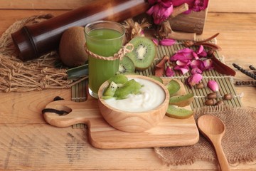 Yogurt white with green kiwi fruit and kiwi juice.