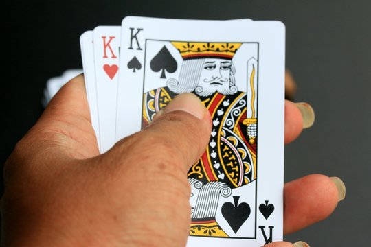 Playing cards on black background