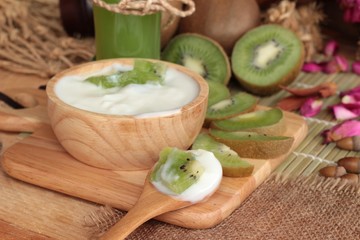 Yogurt white with green kiwi fruit and kiwi juice.