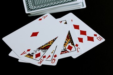 Playing cards on black background