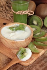 Yogurt white with green kiwi fruit and kiwi juice.