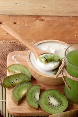 Yogurt white with green kiwi fruit and kiwi juice.