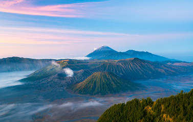 Obraz premium Mount Bromo during sunrise time with fog