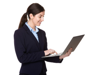 Caucasian businesswoman use of the laptop computer