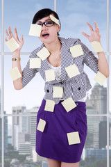 Stressful woman with empty notes