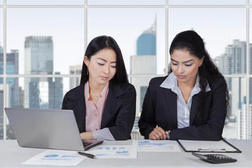 Two businesswomen working at workplace
