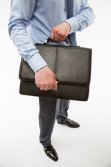 Unrecognizable businessman holding a briefcase