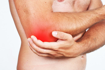 Fototapeta premium Man holding his elbow because of a pain.