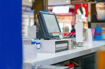 Empty cash desk with computer terminal in cafe