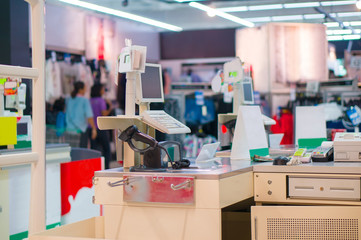 Empty cash desk with computer terminal in mall