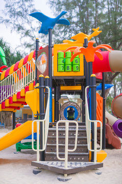 Ladder with hangers to slides on modern kids playground